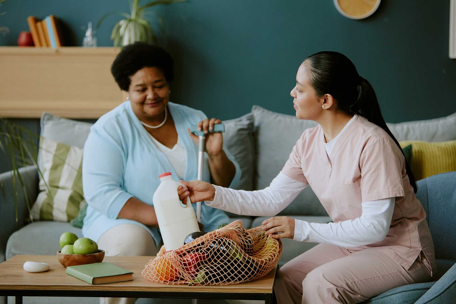 Support worker providing dedicated care to mature patient